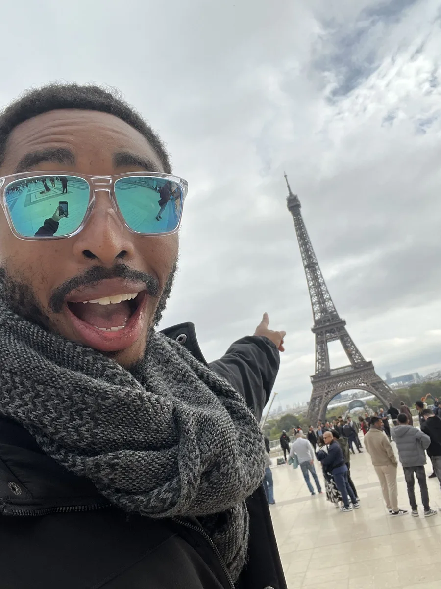 Shawn in front of the Eiffel Tower, Paris