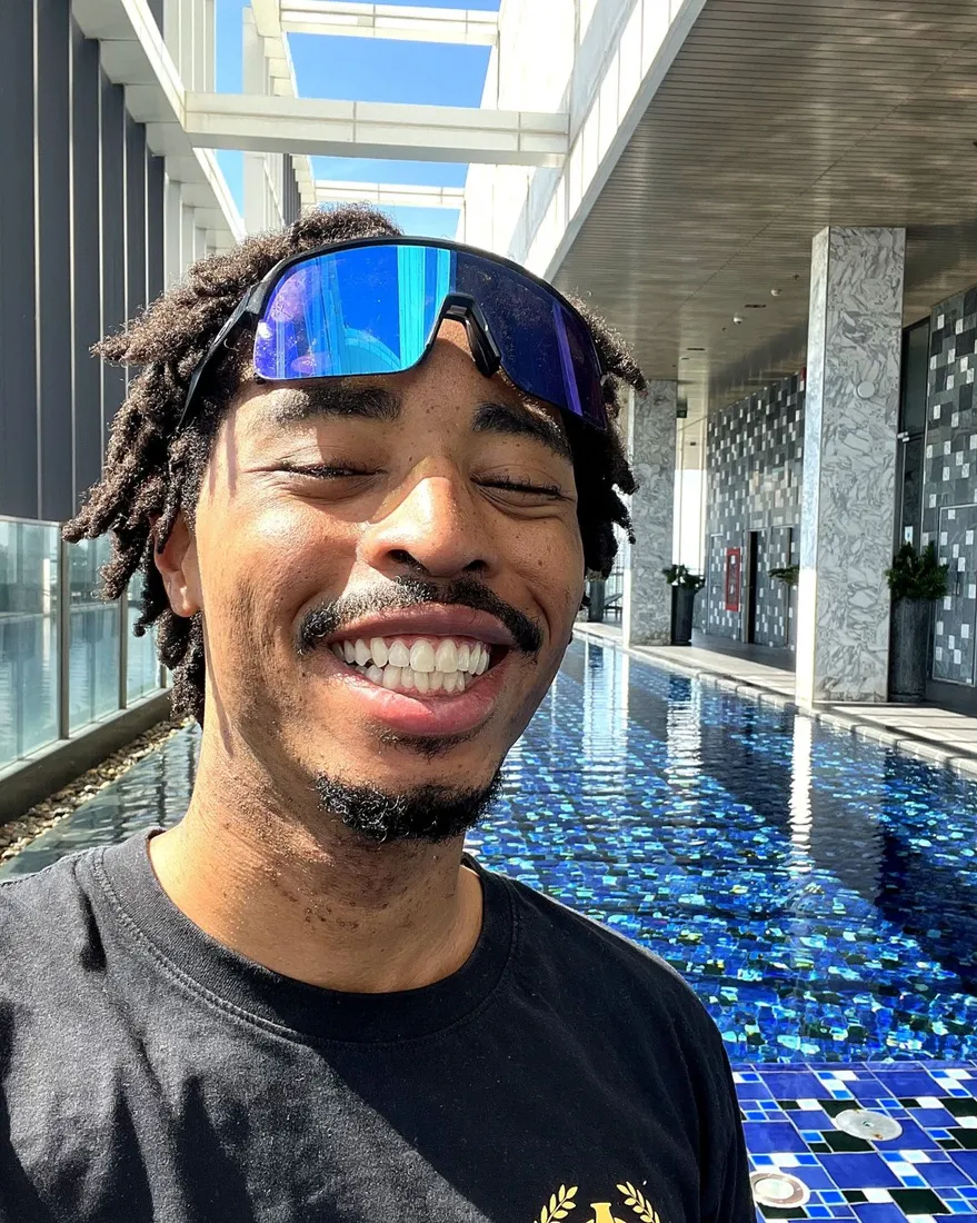 Shawn Arrington smiling on a rooftop
